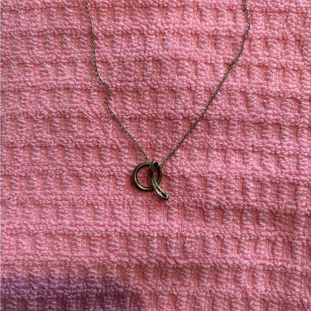 Tiffany & Co. sterling silver “a” pendant and chain.